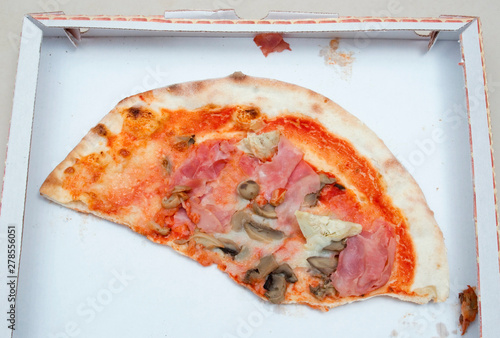 part of pizza in box