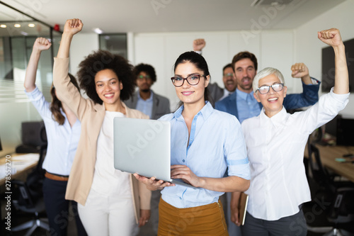 Business team celebrating a good job in the office