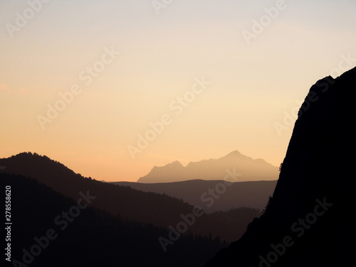 The silhouettes of the mountains at sunset