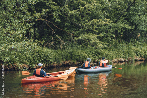 Fototapeta Naklejka Na Ścianę i Meble -  Canoeing on the forest river.