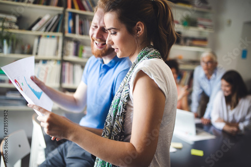 Collaboration and analysis by business people working in office