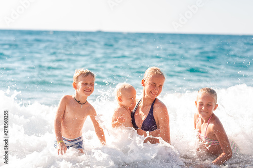 Happy kids on the beach having fun