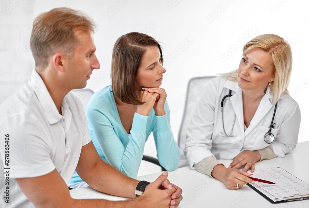 Fototapeta premium family planning, medicine and healthcare concept - couple visiting doctor at fertility clinic