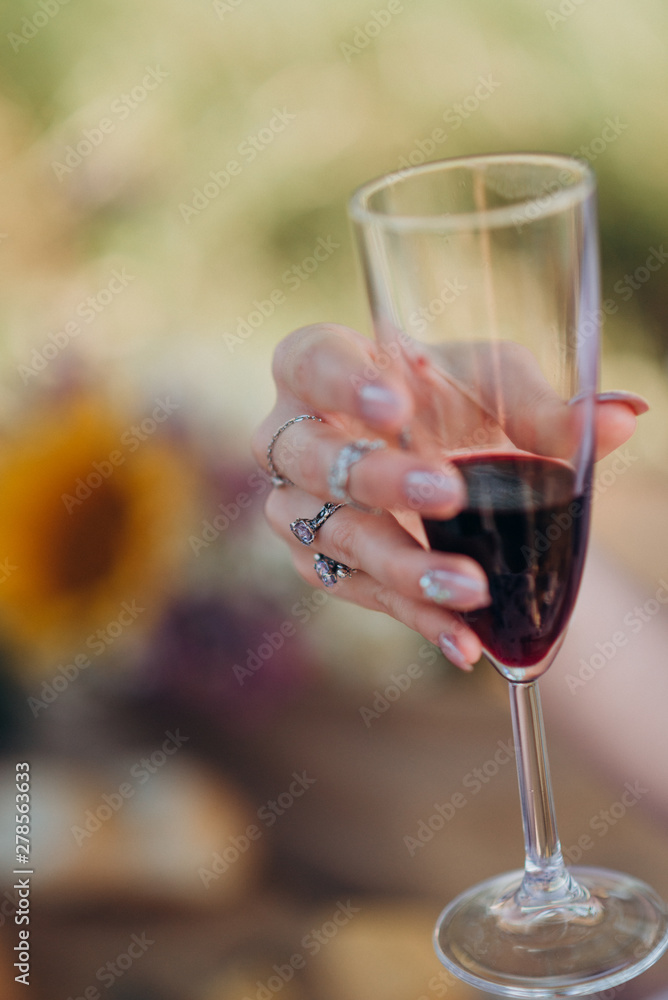 girl holding a glass of red champagne girl holding a glass of red champagne