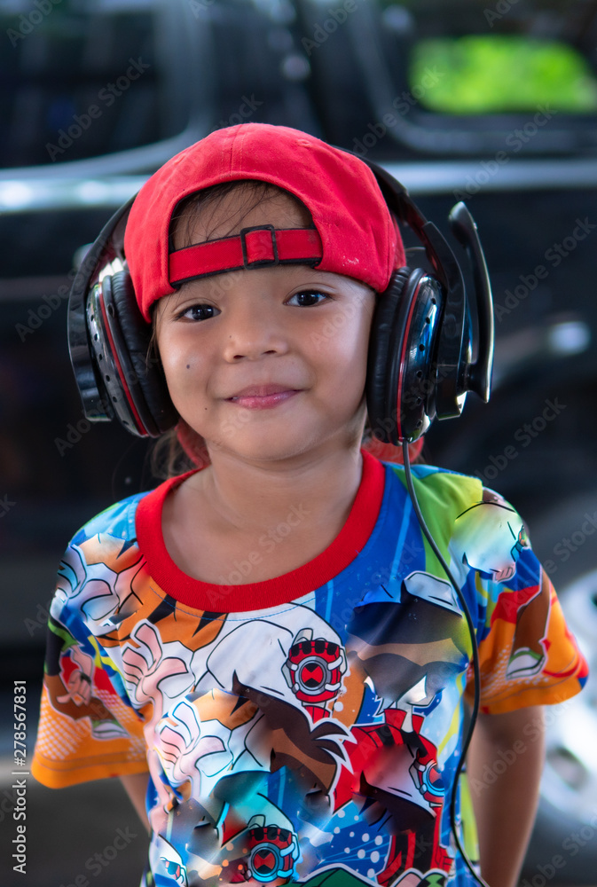 Asian girls enjoy singing and wearing headphones Asian girls enjoy singing and wearing headphones