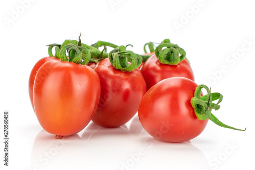 Group of four whole fresh red tomato cherry isolated on white background