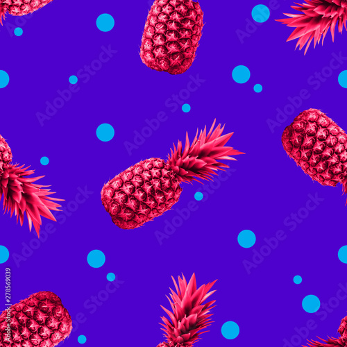 Pineapples Seamless pattern Bright pop-art pattern with many pink pineapples on a vibrant dotted blue background