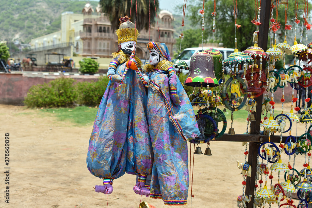 Colorful Rajasthan puppets hanging in the shop of Jaipur, India Stock