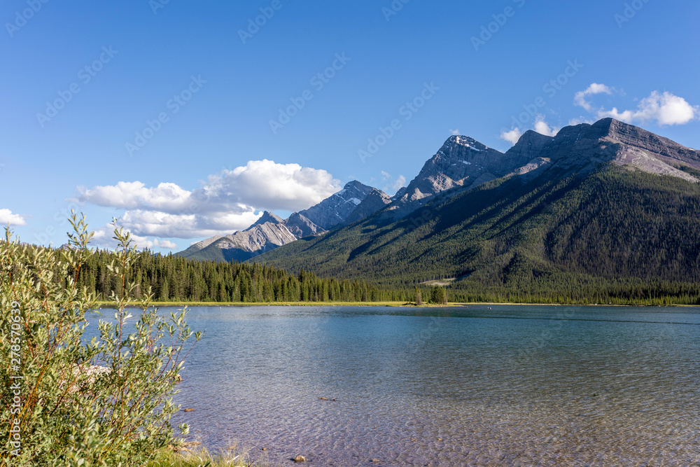 A part of the Goat Mountain Range in canadian Rockies, and the Goat Pond in foreground