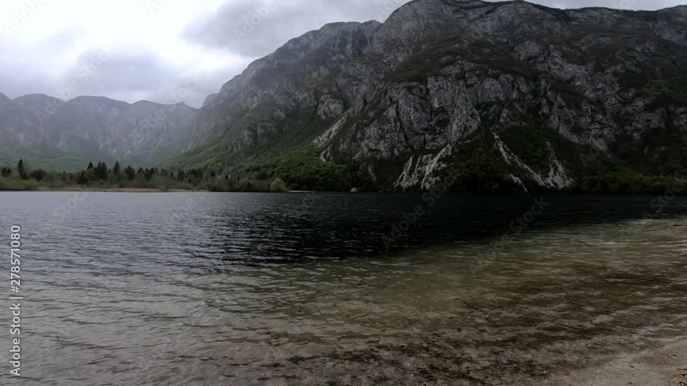 SLOWMO Left pan view of lake Bohinj in spring SLOWMO Left pan view of lake Bohinj in spring