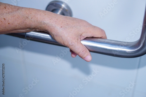 Asian senior or elderly old lady woman patient use toilet bathroom handle security in nursing hospital ward : healthy strong medical concept. 