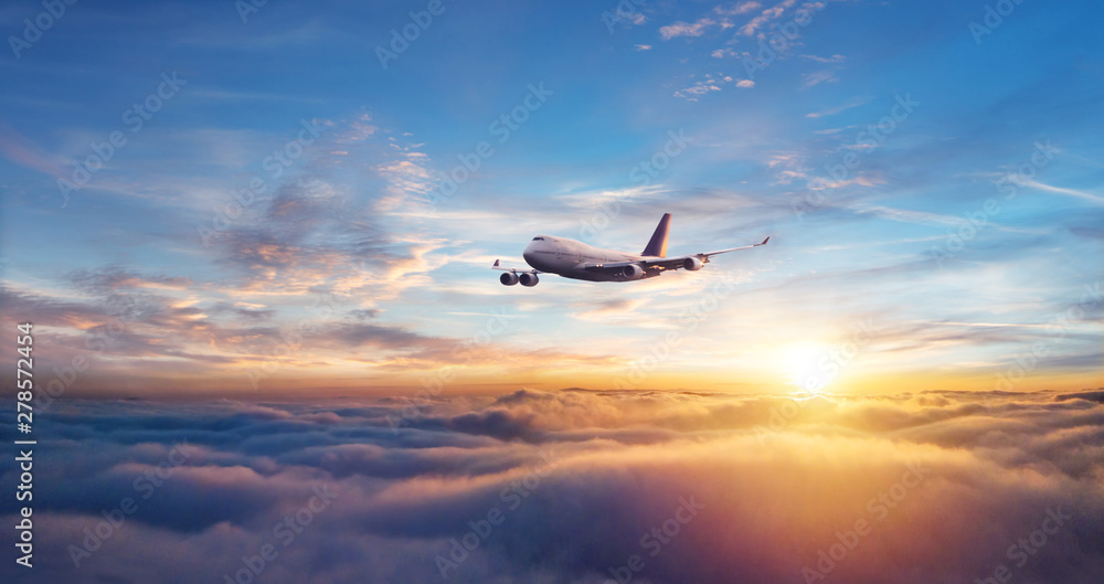 Passengers commercial airplane flying above clouds