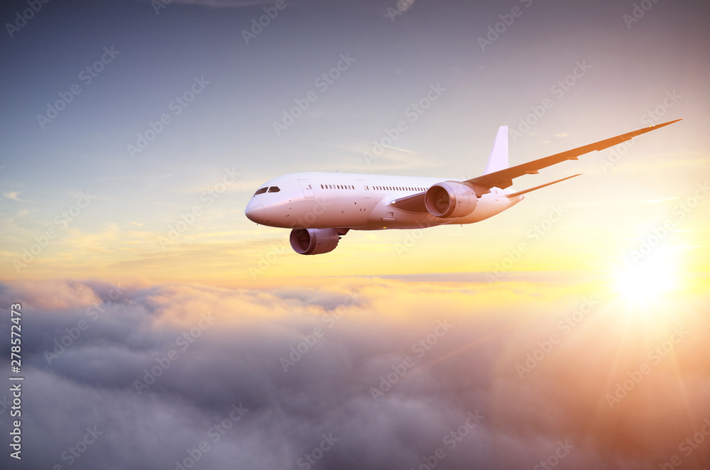 Passengers commercial airplane flying above clouds Passengers commercial airplane flying above clouds