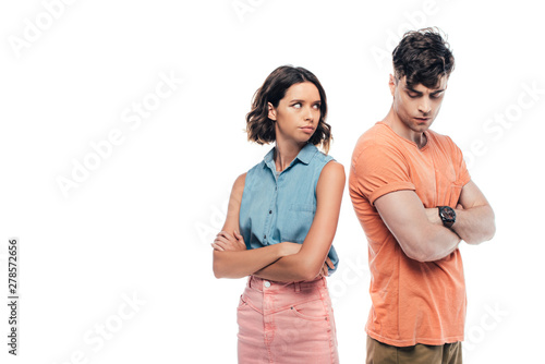 Fotografie offended young couple standing with crossed arms isolated on white