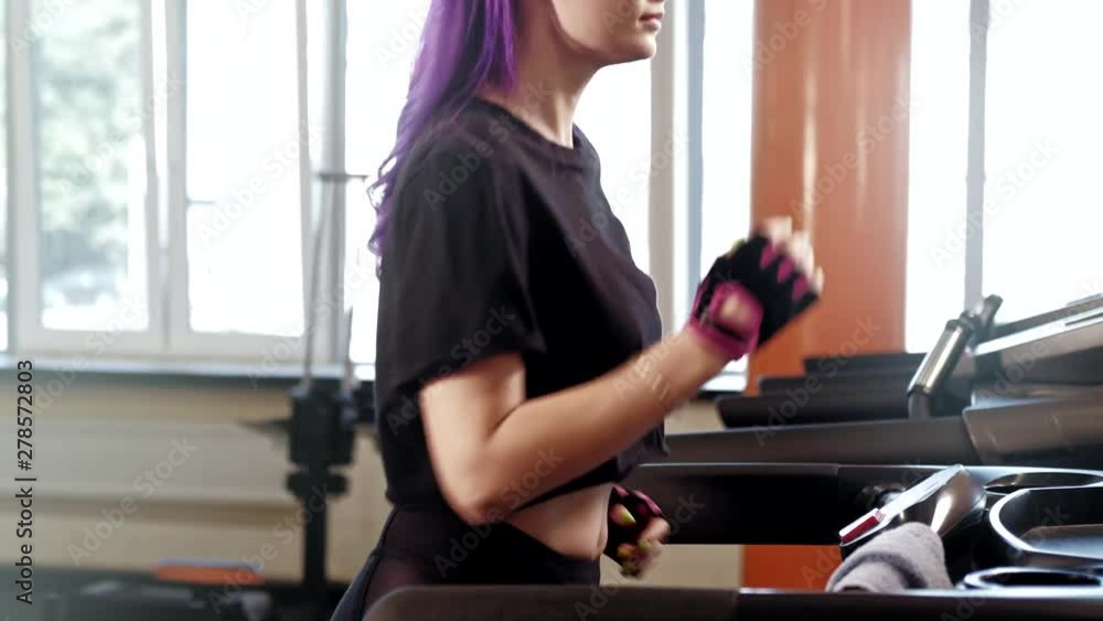 Gym workout warming up. Athletic fit woman running on treadmill. Gym workout warming up. Athletic fit woman running on treadmill.