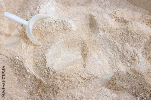 Принти на полотні Mixed  flour varieties and a plastic shovel seen from above