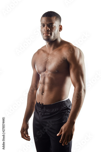 fit pleasant athlete with perfect body poing to the camera. isolated white background.sport, fitness. lifestyle. isolated white background