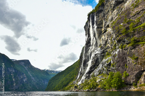 The Seven Sisters spectacular waterfall at Geirangerfjord seens by boat trip, Sunnmore region, Norway,  most beautiful fjords in the world, included on the UNESCO World Heritage. photo