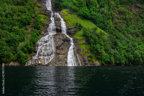 The Seven Sisters unique waterfall at Geirangerfjord seens by boat trip, Sunnmore region, Norway,  most beautiful fjords in the world, included on the UNESCO World Heritage.