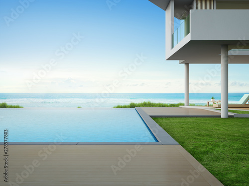 Luxury beach house with sea view swimming pool and terrace in modern design. Empty wooden floor deck at vacation home or hotel. 3d illustration of contemporary holiday villa exterior.