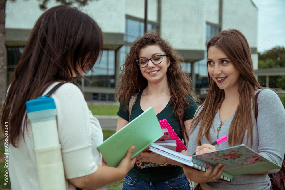 Female college students on university campus Female college students on university campus