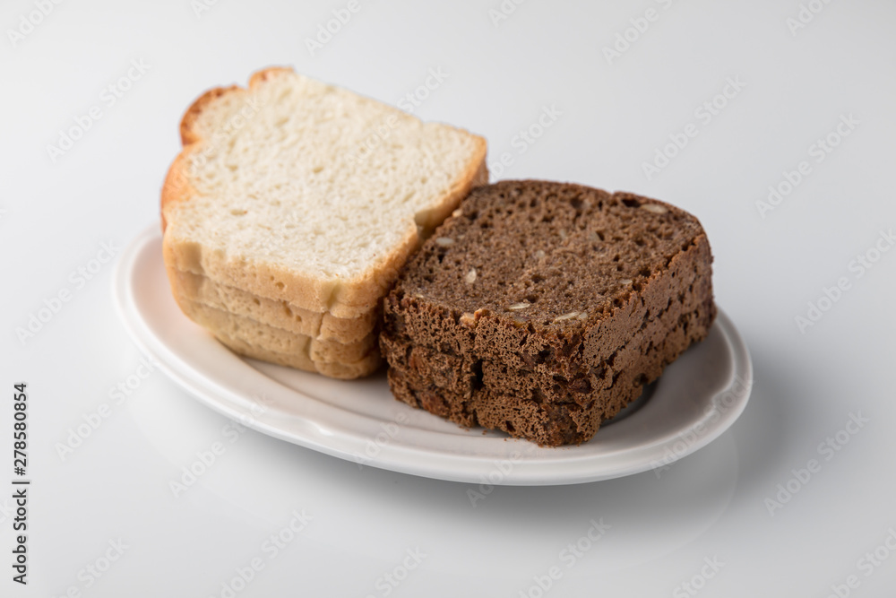 Sliced bread. Beautifully decorated catering banquet menu. Food snacks and appetizers for buffet. Isolated on white background Sliced bread. Beautifully decorated catering banquet menu. Food snacks and appetizers for buffet. Isolated on white background
