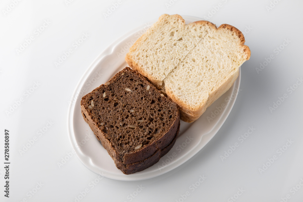 Sliced bread. Beautifully decorated catering banquet menu. Food snacks and appetizers for buffet. Isolated on white background Sliced bread. Beautifully decorated catering banquet menu. Food snacks and appetizers for buffet. Isolated on white background