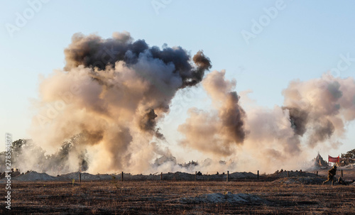 Explosions of bombs and shells. Reconstruction of the battle of world war II. Battle for Sevastopol. Reconstruction of the battle with explosions. Tanks and soldiers during the battle.