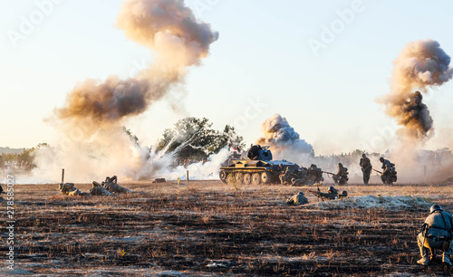 Explosions of bombs and shells. Reconstruction of the battle of world war II. Battle for Sevastopol. Reconstruction of the battle with explosions. Tanks and soldiers during the battle.