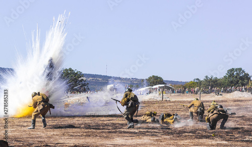 Explosions of bombs and shells. Reconstruction of the battle of world war II. Battle for Sevastopol. Reconstruction of the battle with explosions. Tanks and soldiers during the battle.