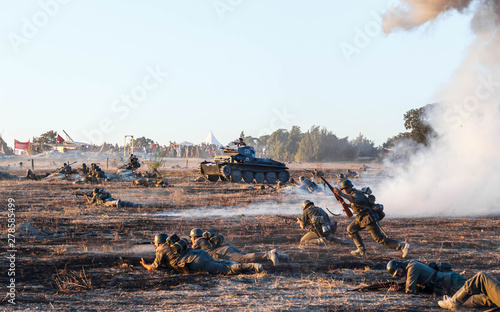 Explosions of bombs and shells. Reconstruction of the battle of world war II. Battle for Sevastopol. Reconstruction of the battle with explosions. Tanks and soldiers during the battle.