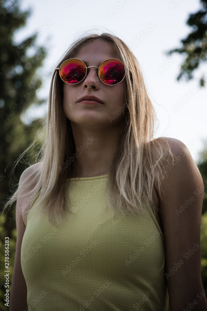 Attractive blond woman in trendy red sunglasses Attractive blond woman in trendy red sunglasses