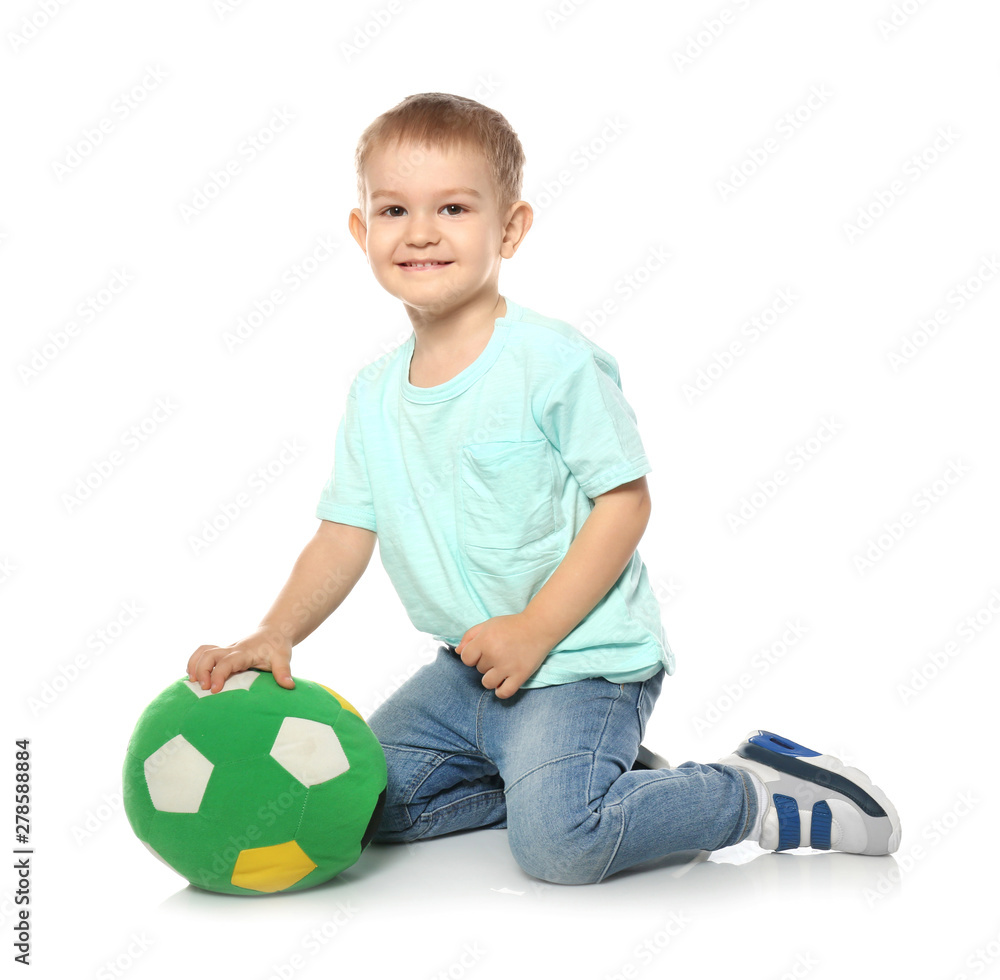 Cute little child with soft soccer ball on white background. Playing indoors Cute little child with soft soccer ball on white background. Playing indoors