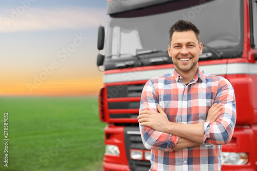 Fotografija Portrait of driver at modern truck outdoors. Space for text