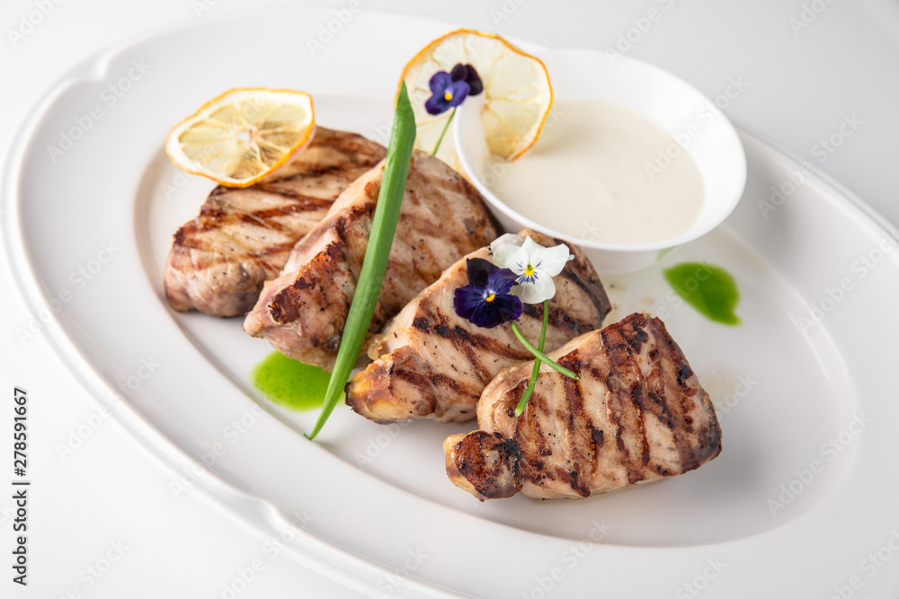 Grilled fish fillet: dorada, cod, halibut, pollock, tilapia. Seafood. Banquet festive dishes. Fine dining restaurant menu. White background.