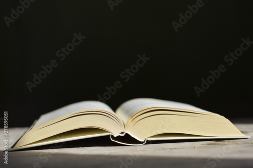open book on black background