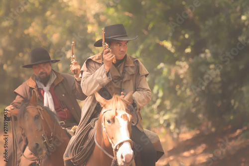 Cowboy riding horse.Cowboy on horseback.   © Chinnachote