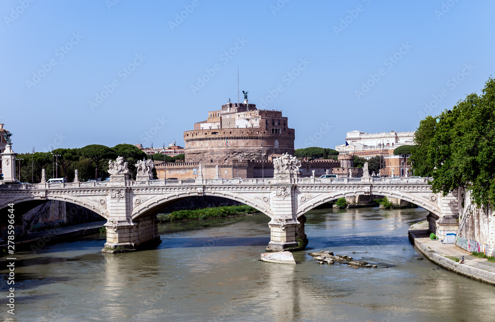Vittorio Emanuele II bridge over the Tiber river, with the Sant'Angelo castle in the background - Rome, Italy.