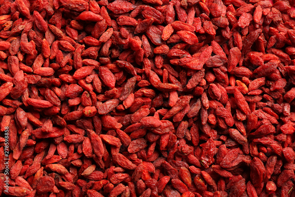 Fototapeta premium Many dried goji berries as background, top view. Healthy superfood
