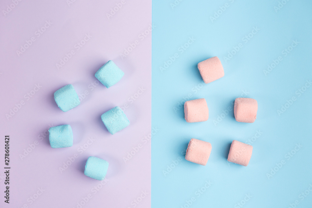 Marshmallow on blue and violet backgrounds. Two colors. Top view. Marshmallow on blue and violet backgrounds. Two colors. Top view.