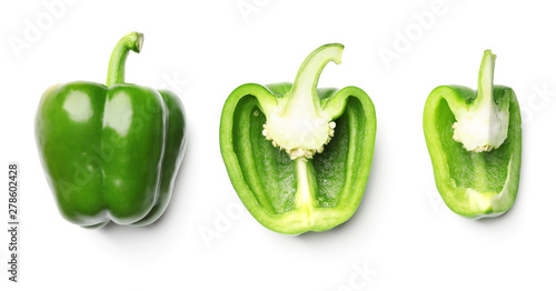 Foto Whole and cut green bell peppers on white background, top view