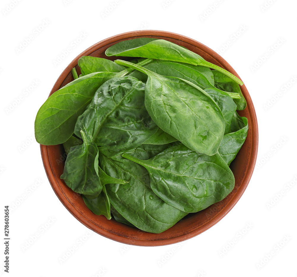 Fresh green healthy baby spinach leaves in clay bowl isolated on white, top view Fresh green healthy baby spinach leaves in clay bowl isolated on white, top view