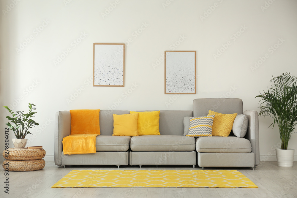 Stylish living room interior with comfortable grey sofa - obrazy, fototapety, plakaty 