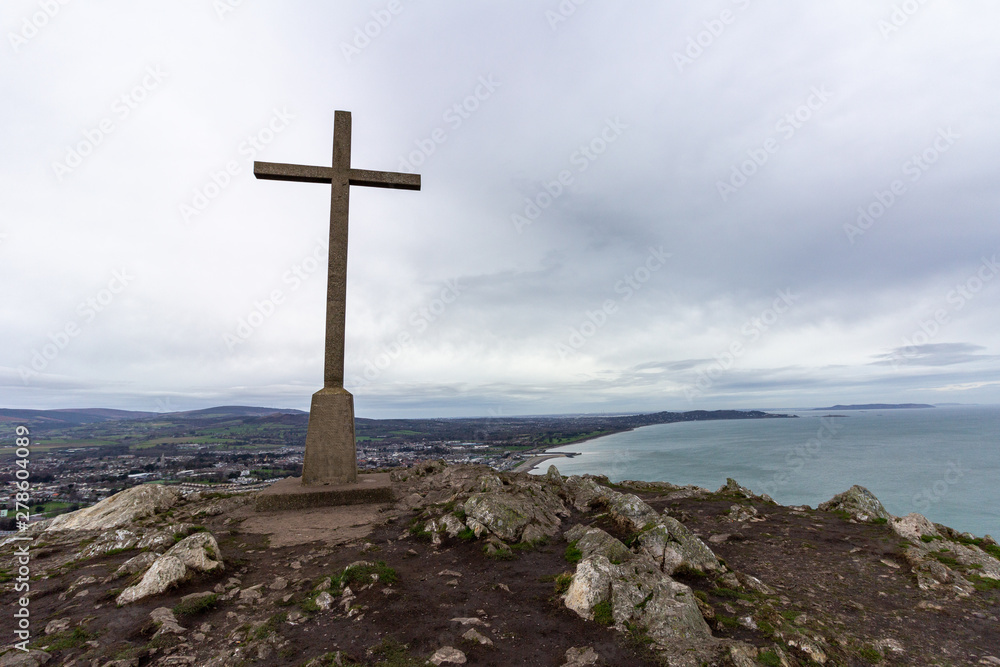 Cross at the highest point in Bray Head overlooking the Irish coastline