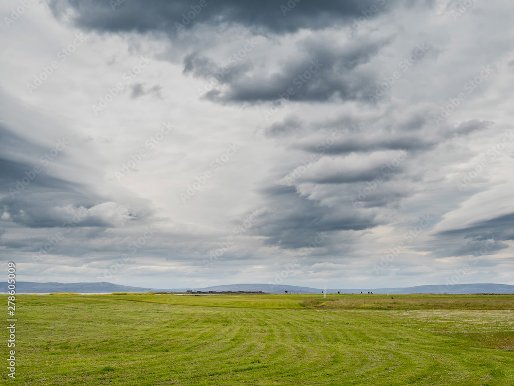 Simple landscape, Green field and dramatic cloudy sky. Simple landscape, Green field and dramatic cloudy sky.