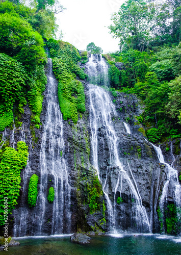 Banyumala waterfall with cascades among the green tropical trees and plants in the North of the island of Bali  Indonesia