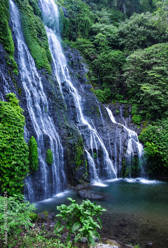 Banyumala waterfall with cascades among the green tropical trees and plants in the North of the island of Bali  Indonesia