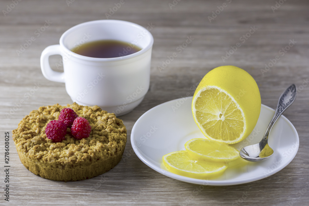 Homemade crumbly shortbread with a cup of tea. Homemade crumbly shortbread with a cup of tea.