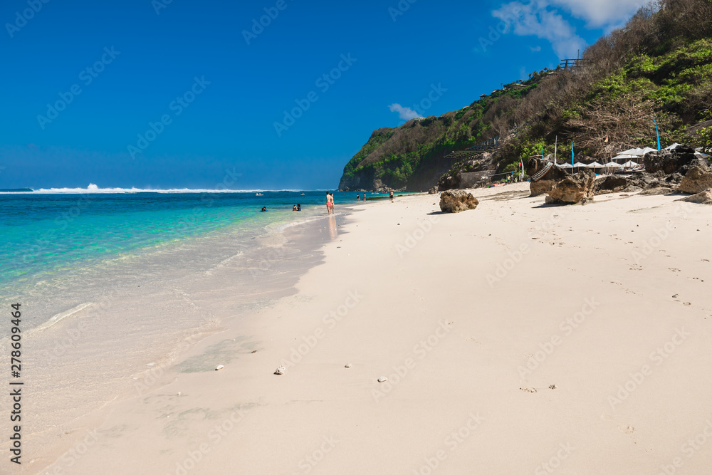 Tropical sandy beach with blue ocean in paradise island