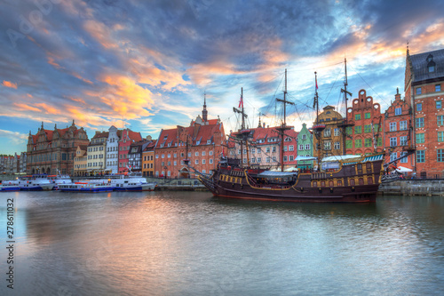 Beautiful old town of Gdansk over Motlawa river at sunset, Poland.